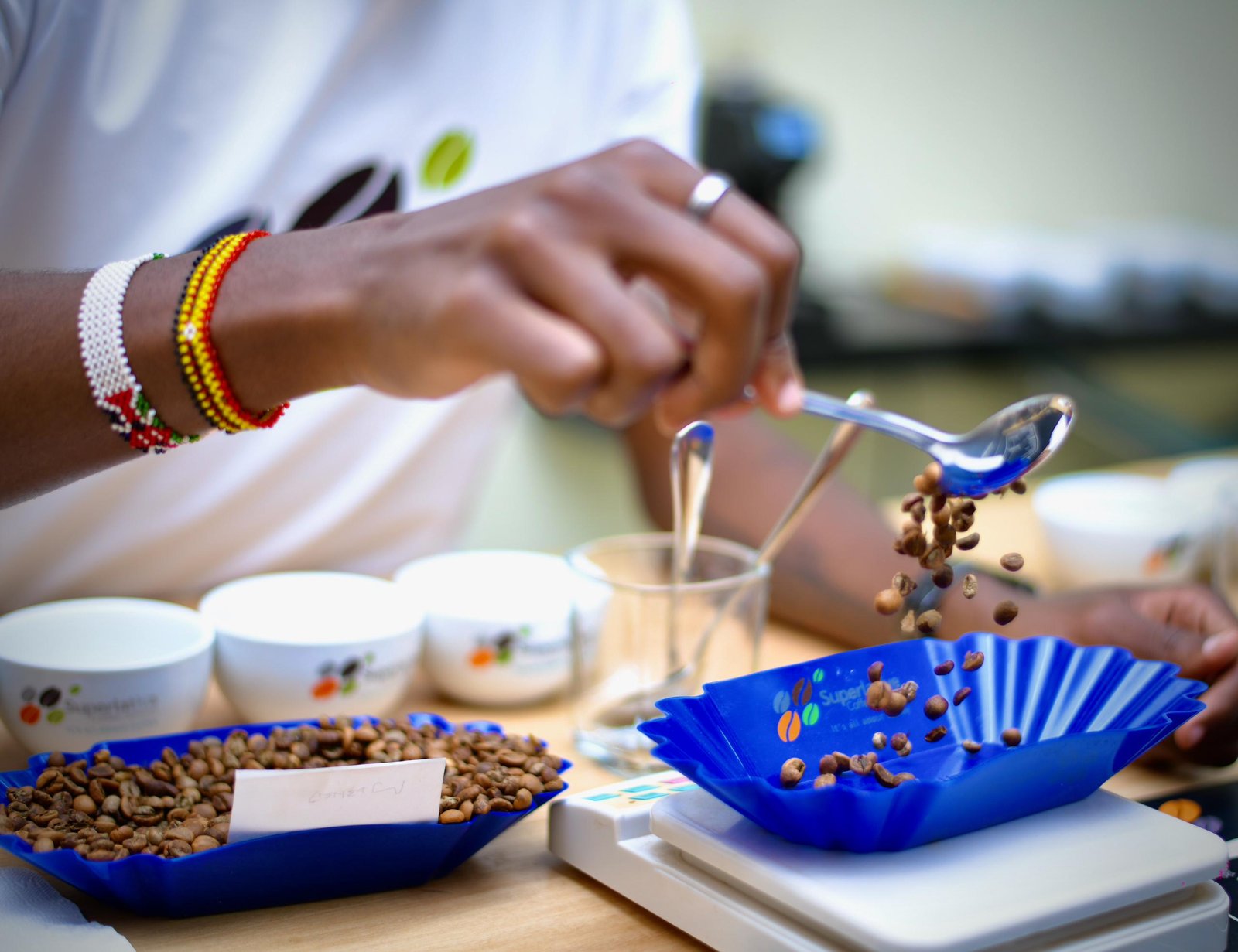 WEIGHING ROASTED COFFEE.